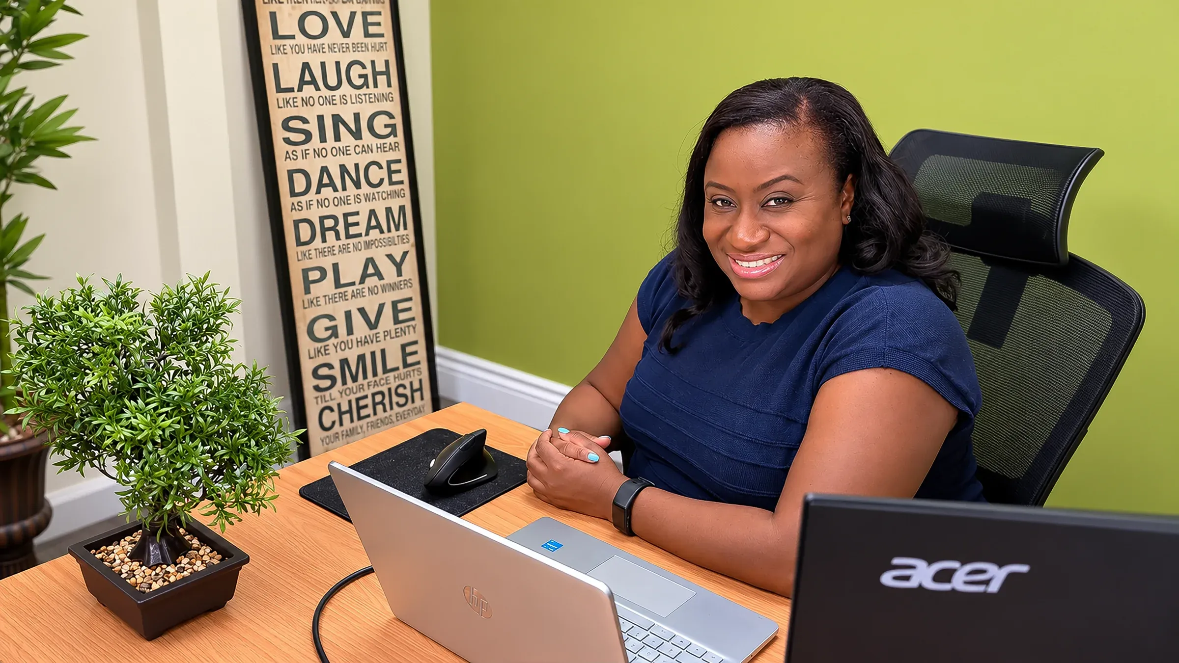 A member of the CallServ management team at her desk in the Trinidad office.